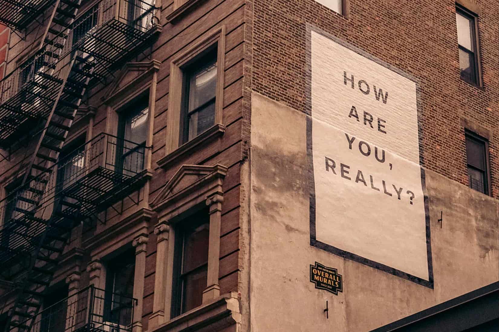 Wall with a sign that asks 'How are you, really?'